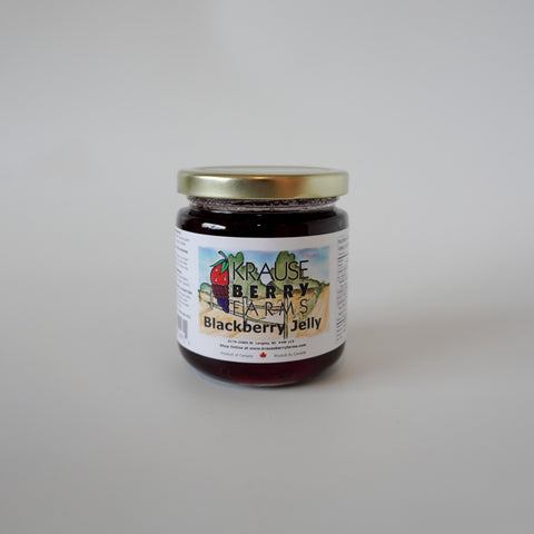 Jar of Krause Berry Farms Blackberry Jelly on a gray background