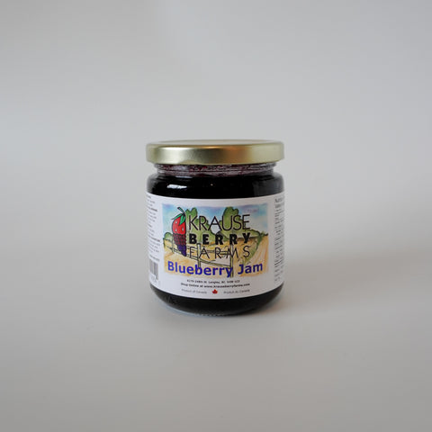 Jar of Krause Berry Farms Blueberry Jam on a plain background