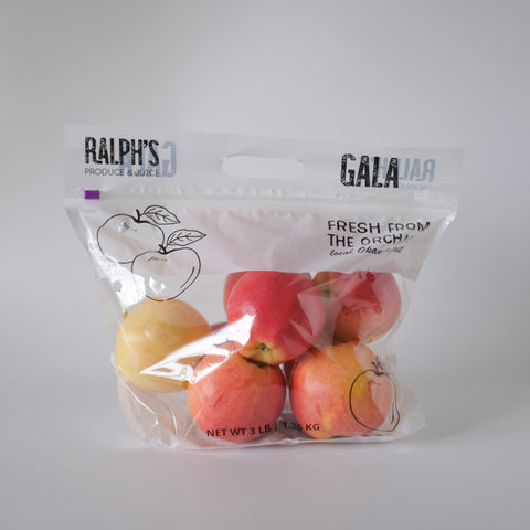 Packaged apples with 'Ralph's Produce & Juice' branding on a white background