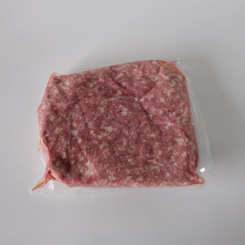 Packaged ground Duck meat on a white background
