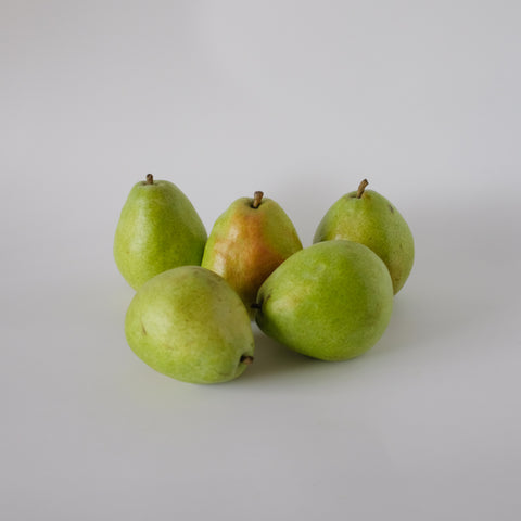 Five green pears on a white background