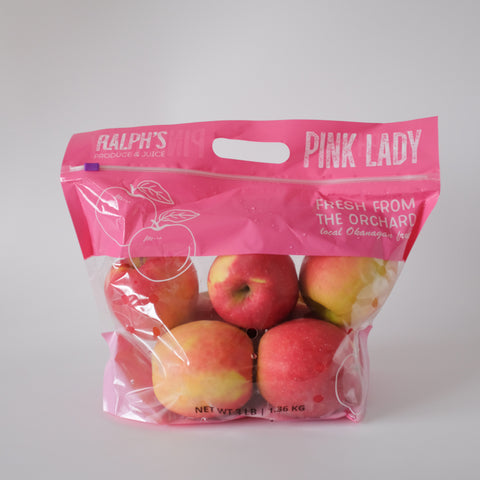 Pink Lady apples in a Ralph's packaging on a white background