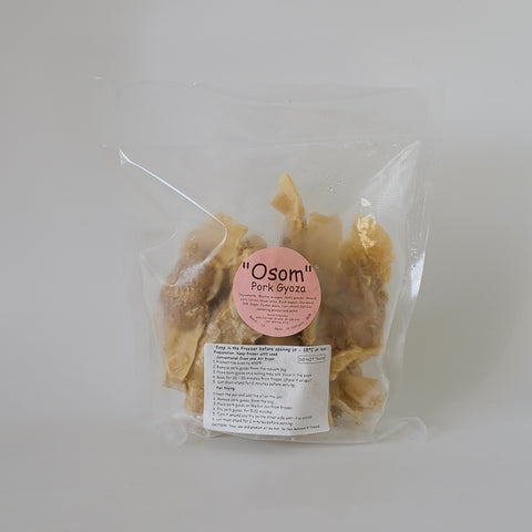 Packaged pork gyoza with 'Osom' label on a white background