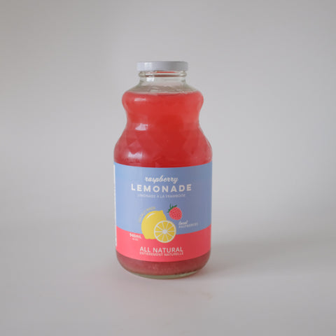Bottle of raspberry lemonade on a gray background